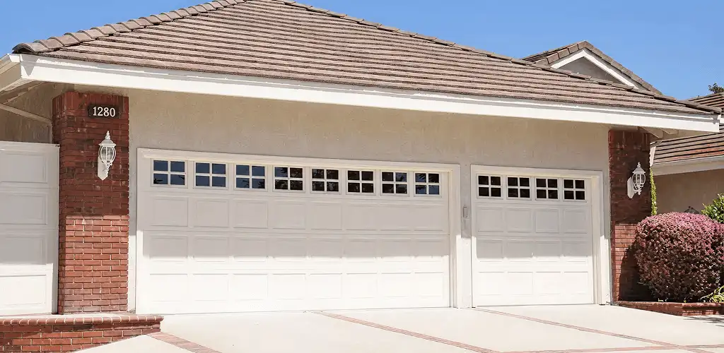Residential garage door repair service for a double garage door in Cleveland, OH