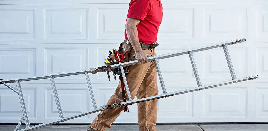 Garage door repair technician arriving with tools and ladder in Cleveland, OH