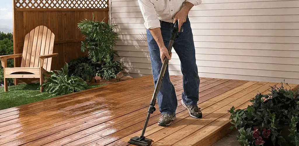 Deck staining service applying stain to a backyard wood deck in Cleveland, OH